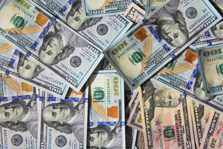 US dollar bills representing currency conversion for freelancer payments