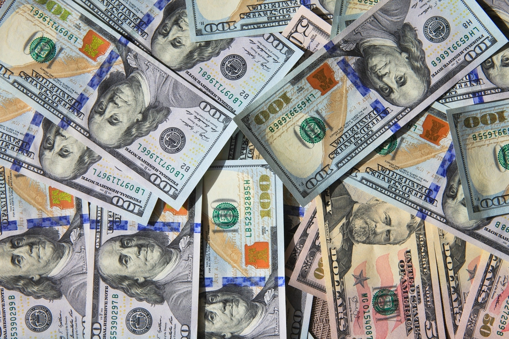US dollar bills representing currency conversion for freelancer payments