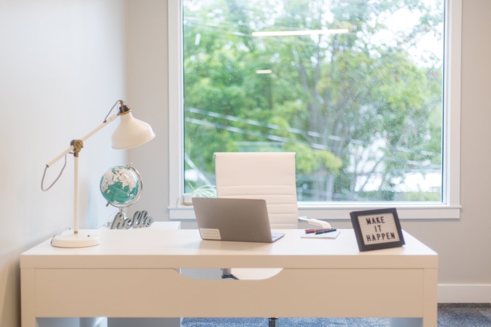 Kenyan freelancer working on a laptop and withdrawing Upwork earnings